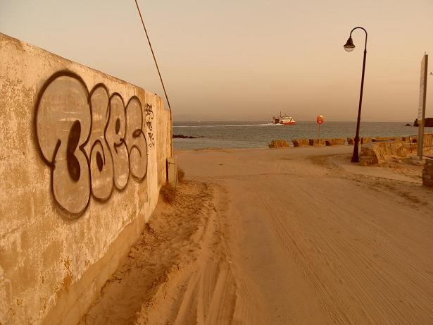 Tarifa, Spain sunset and graffiti, looking towards Africa