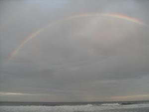 Rainbow over beach at Playa Cocles, Puerto Viego